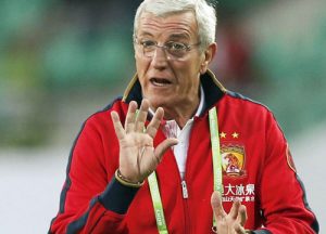 Guangzhou Evergrande's coach Marcello Lippi gestures during the game of the FIFA Club World Cup soccer tournament against Al Ahly, in Agadir, Morocco, Saturday, Dec. 14, 2013. (AP Photo/Christophe Ena)